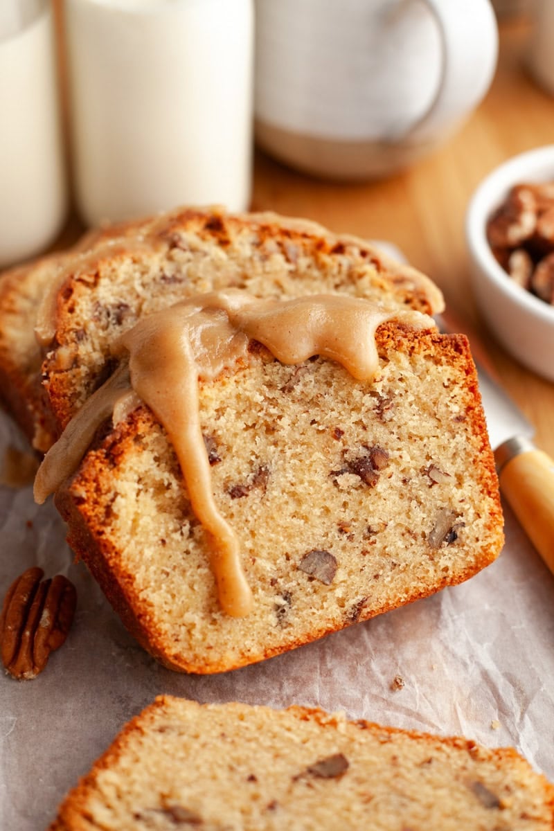 Slices of butter pecan pound cake with a brown sugar glaze dripping down.