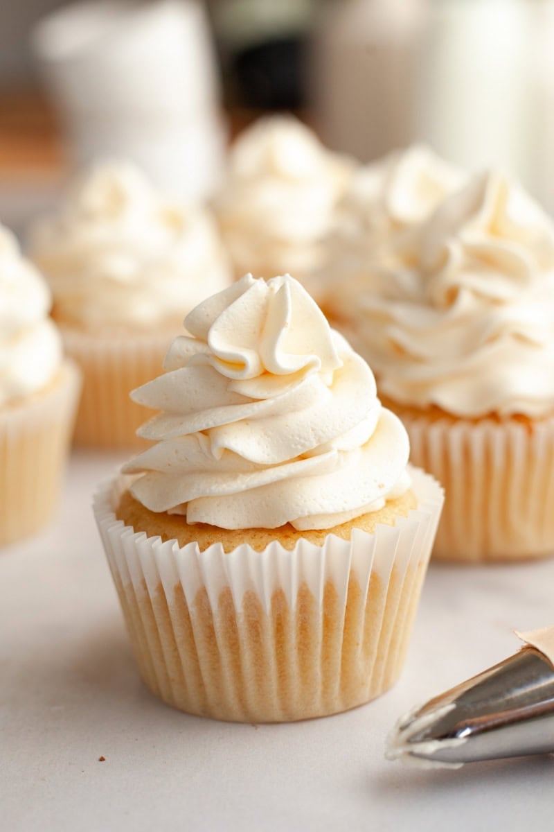 A vanilla cupcake frosted with browned butter frosting.