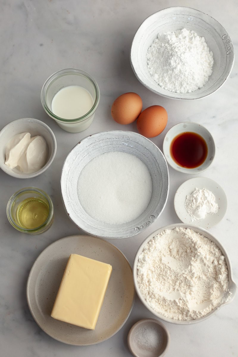 All the ingredients needed to make browned butter cupcakes, weighed out into small bowls.