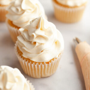 Vanilla cupcakes frosted with browned butter frosting.